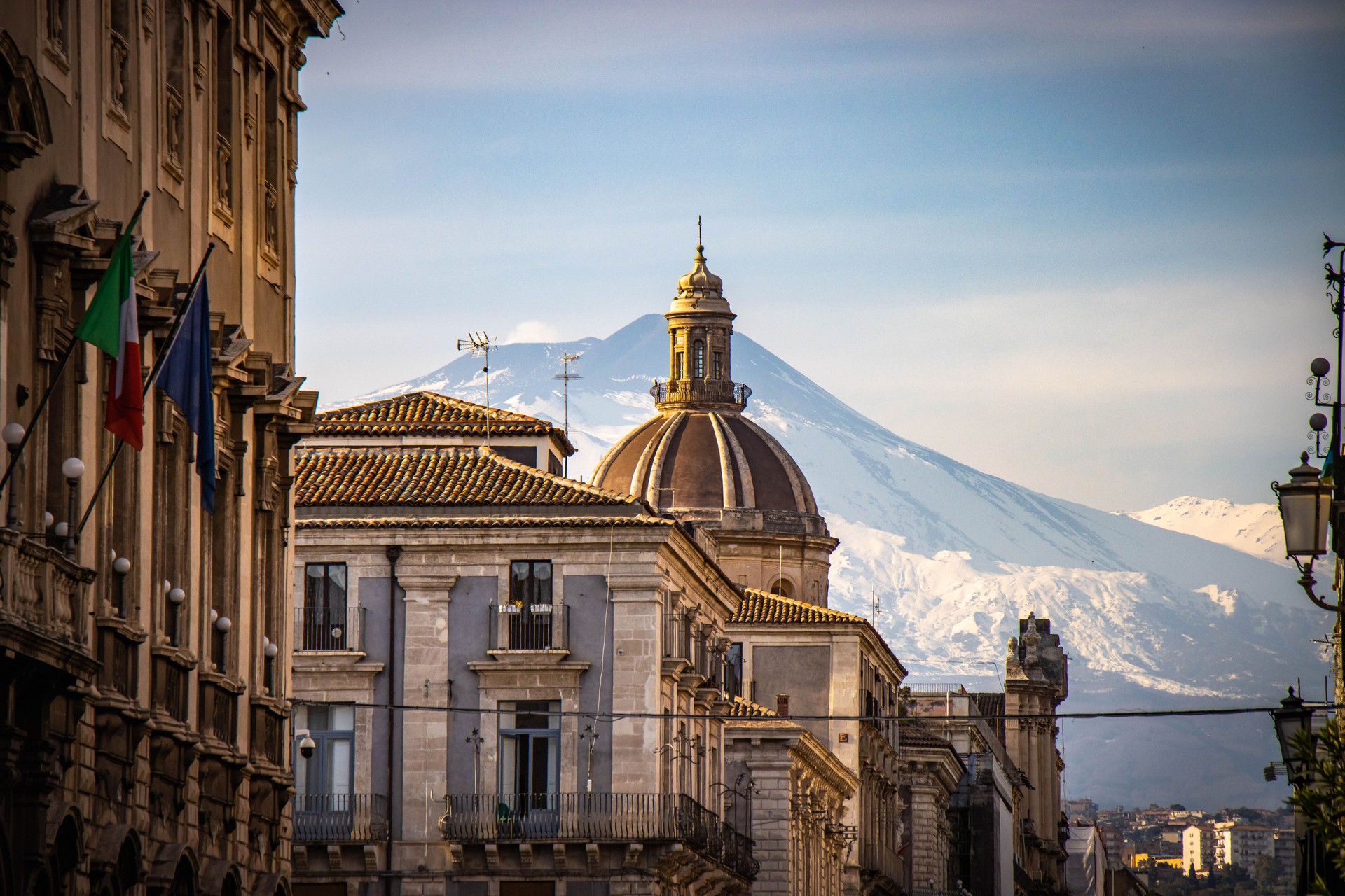 sicilian city Catania with snow capped Etna in background. Sicily, Europe